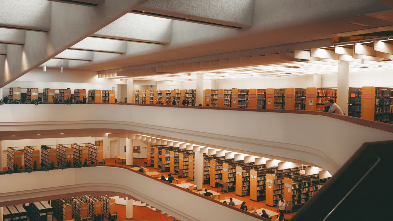 Home Explore the expansive, modern architecture of a Toronto library, showcasing multiple reading levels.